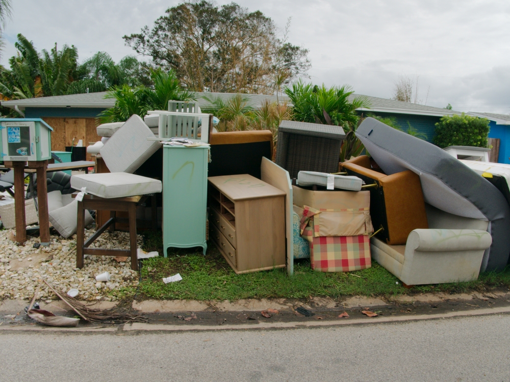 Large,piles,of,trash,,furniture,,household,items,stacked,on,side