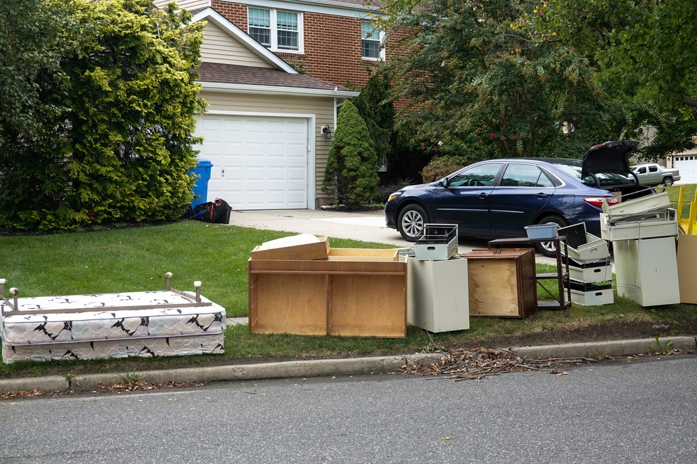 Discarded,wooden,furniture,and,an,old,bed,lined,up,by